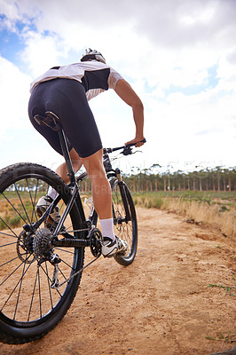 Buy stock photo Shot of a cyclist riding outdoors