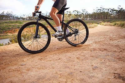 Buy stock photo Cropped shot of a cyclist riding outdoors