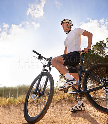 Buy stock photo Shot of a cyclist riding outdoors