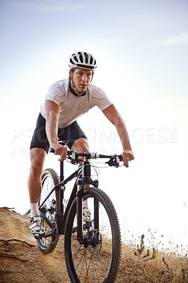 Buy stock photo Shot of a cyclist riding outdoors