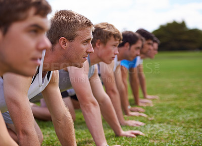 Buy stock photo Group, men and field for push up with fitness, training and health with friends for sport, challenge or wellness. People, athlete and teamwork with exercise, workout and together on field for muscle