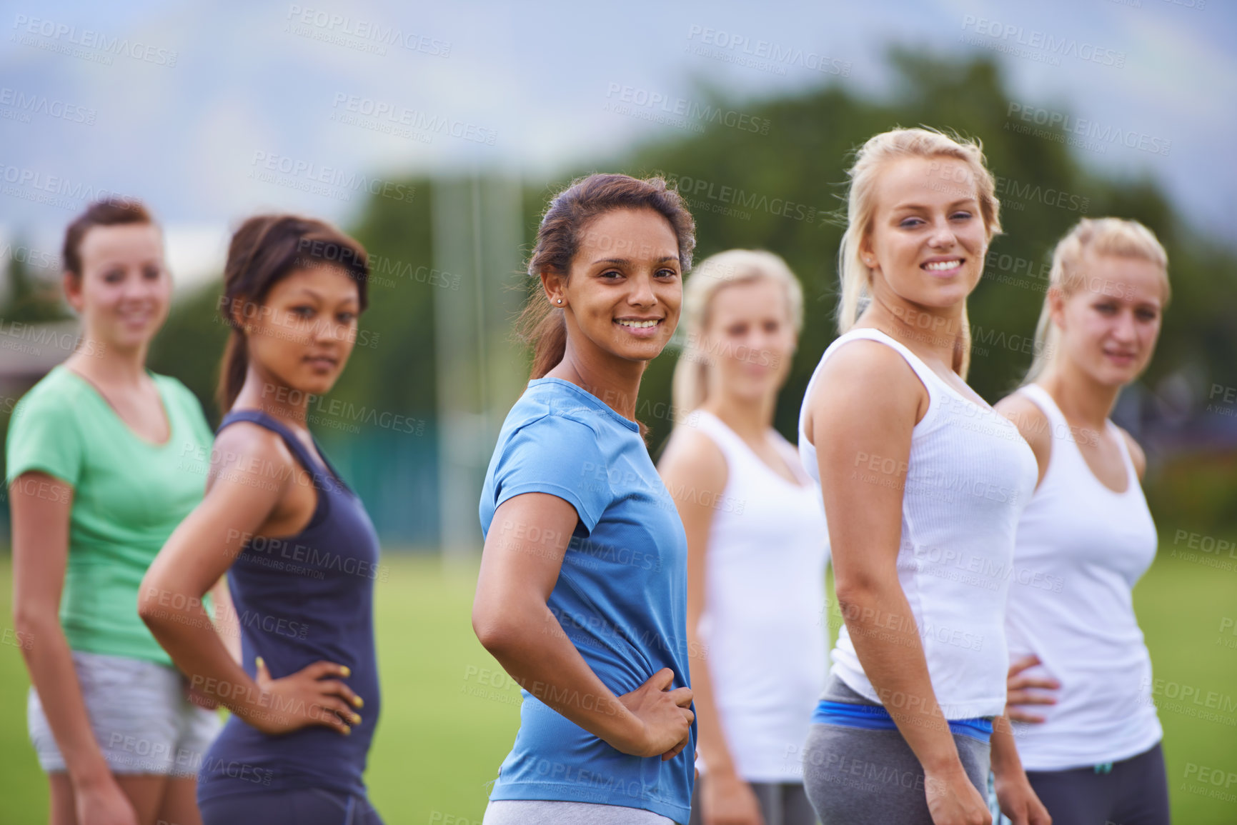 Buy stock photo Team, women and friends with sports on field for health, fitness and training with diversity in summer. People, exercise and games in group on grass for workout, wellness or together in Los Angeles