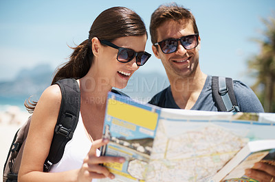Buy stock photo Couple, map and search on travel by ocean, mountains or idea to check direction for help on vacation. Woman, man and chart for location, landmark or reading with thinking on holiday at beach in Italy