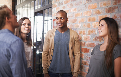 Buy stock photo Talking, friends or students in a college hallway for discussion, happiness and a chat. Group of diversity men and women at campus or university for conversation about education career or school work