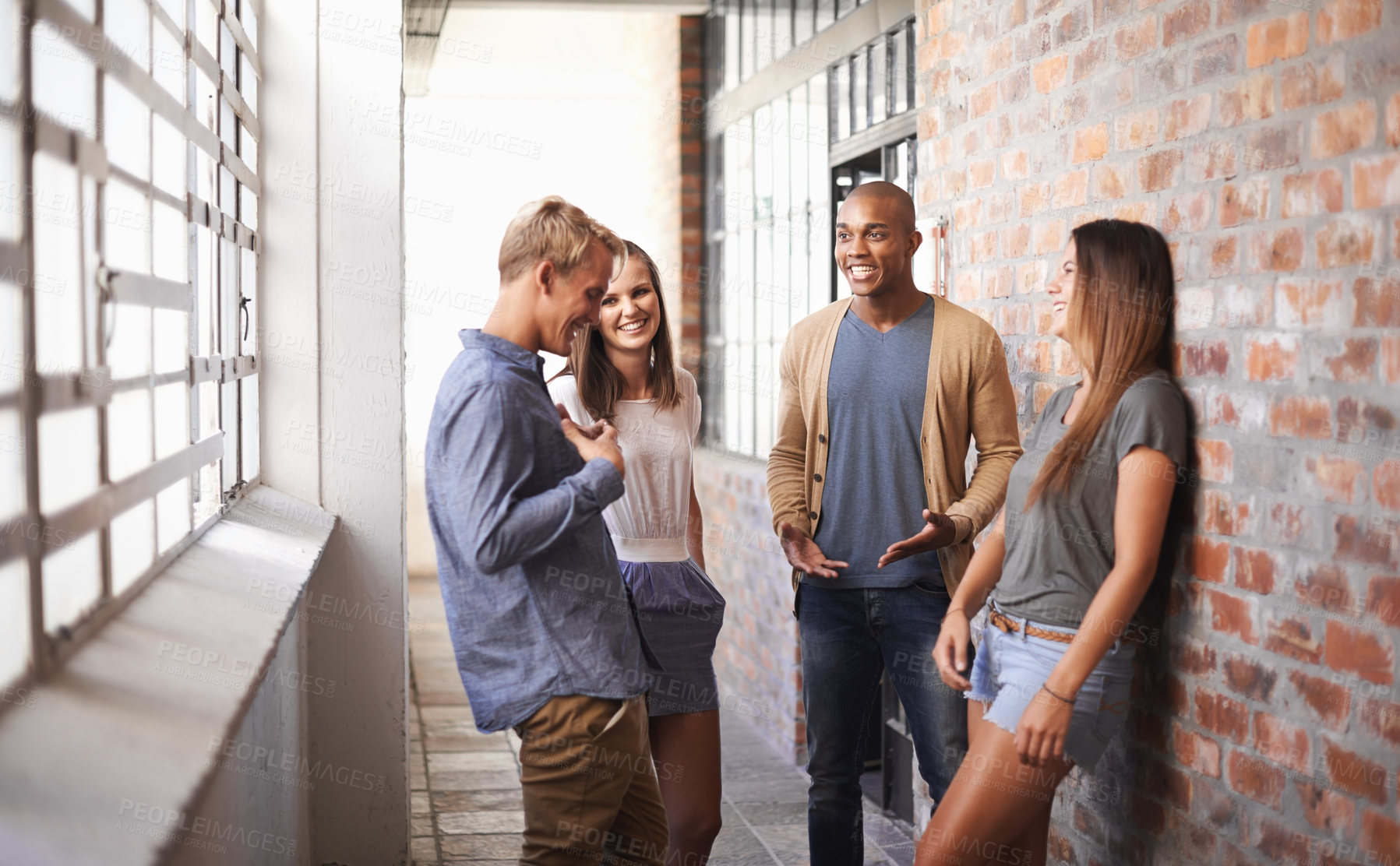 Buy stock photo College, talking and friends or students laughing in a hallway for discussion, happiness or funny chat. Group of women and diversity men at campus or university to talk about education or school work