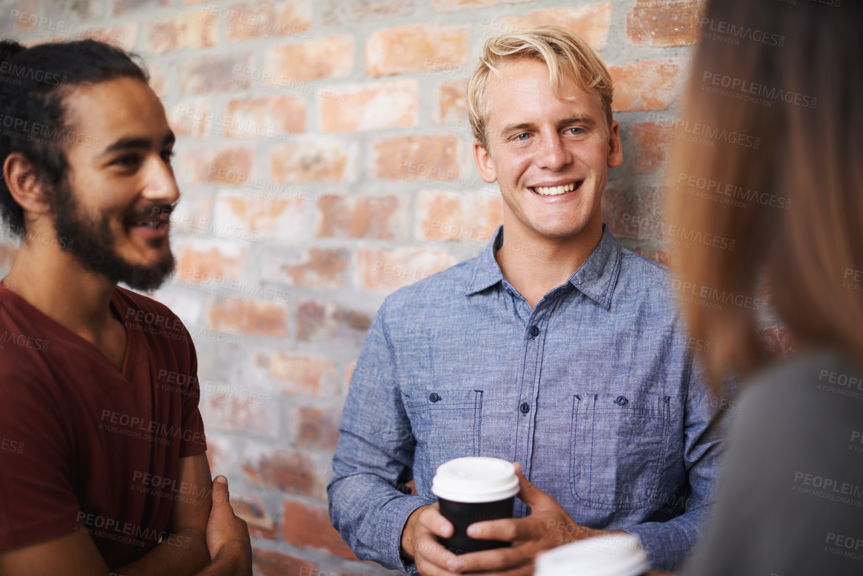 Buy stock photo Friends, university and students in a hallway, conversation and funny with discussion and lunch break. Group, college and men with woman in a lobby or education with laughing or joke with knowledge