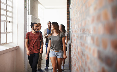 Buy stock photo University, walking and students in a lobby, conversation and speaking with humor or education. Group, men or women in a hallway with discussion or learning with knowledge or college with scholarship