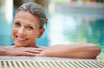 Buy stock photo Cropped shot of a mature woman in the hotel swimming pool