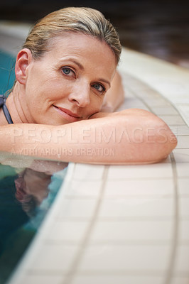 Buy stock photo Swimming pool, portrait and woman relax on holiday, summer vacation and weekend getaway. Travel, luxury spa resort and happy female person relaxing in water for happiness, wellness and peace outdoors