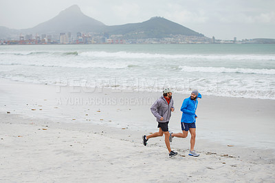 Buy stock photo Men, cardio and running on beach, sand and fitness for wellness and gym wear on coast together. Male athletes, jog and training for seaside, health and outdoor for sport and exercise for freedom