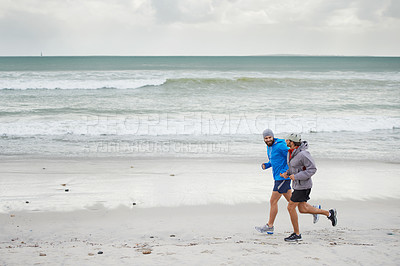 Buy stock photo Seaside, men and running on beach, sand and fitness for wellness and gym wear on coast together. Male athletes, jog and training for ocean, health and outdoor for sport and exercise together