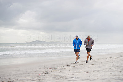 Buy stock photo Men, ocean and running on beach, sand and fitness for wellness and gym wear on coast together. Male athletes, jog and training for seaside, health and outdoor for sport and exercise for body workout 