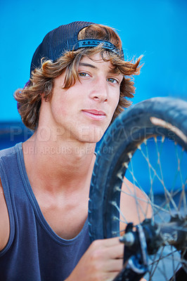 Buy stock photo Bicycle, tire and portrait of man outdoor at skatepark in summer with maintenance, repair or inspection. Bike, care and person fixing wheel or cyclist check air in tyre for performance in cycling