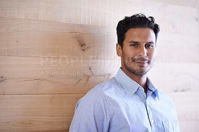 Buy stock photo Businessman, portrait and happy professional in office with confidence and career development in workplace. Designer, indian or face for pride in creative job or fashion shirt by wooden background