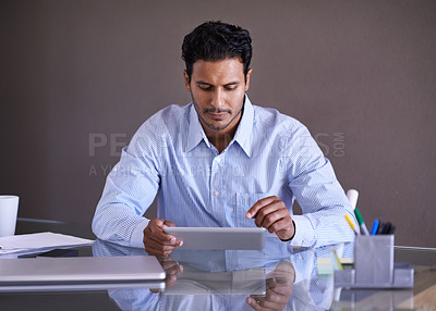 Buy stock photo Businessman, tablet and networking by desk on social media and connection for online research in office. Entrepreneur, touchscreen or technology on small business website or scroll in startup company