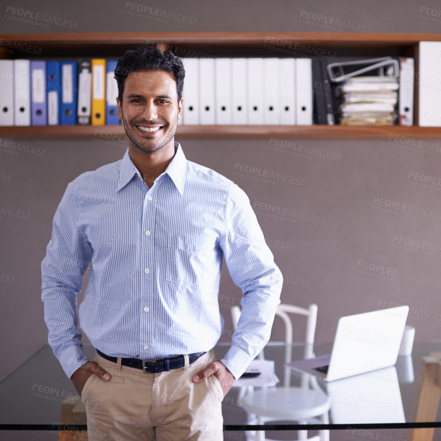 Buy stock photo Cropped shot of a handsome young businessman in his office