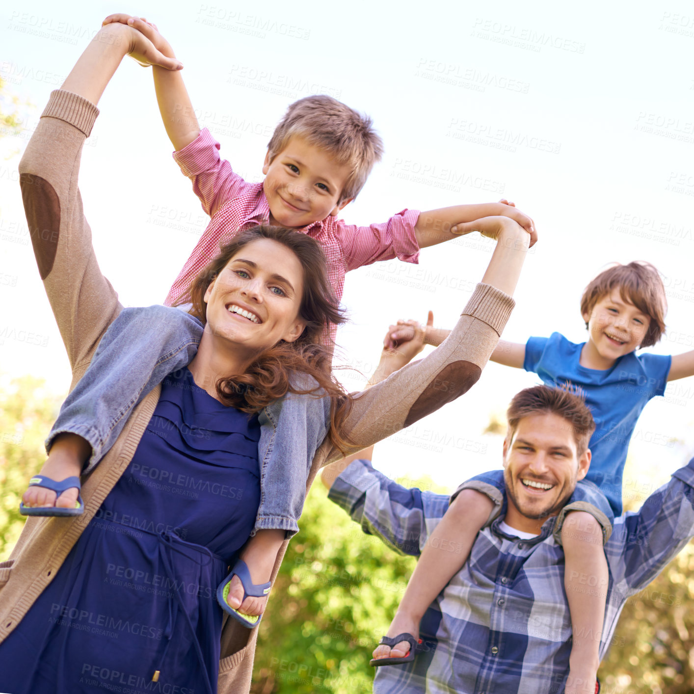 Buy stock photo Smile, nature and children on parents shoulders in outdoor park or field for playing together. Happy, bonding and low angle portrait of mother and father carrying boy kids for fun in garden in Canada