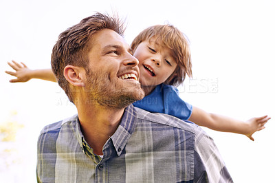 Buy stock photo Father, fun and park with child and piggy back outdoor with happiness, love and care. Family smile, dad and young kid together with play flying and feeling happy from youth in nature with cute son