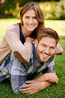 Buy stock photo Couple, park and grass with smile, portrait and love for date and relationship or bonding. Man, woman and nature with romance, new york and sunshine lying together on outdoor adventure or holiday