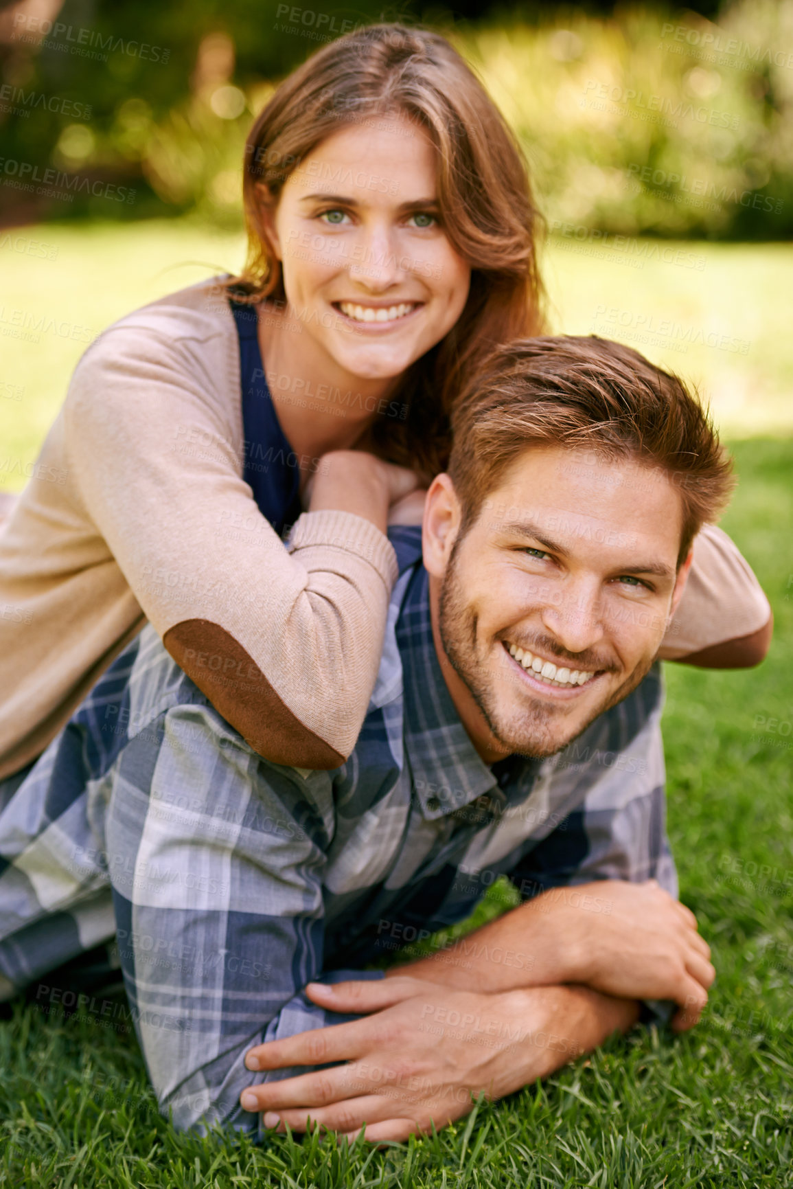 Buy stock photo Couple, park and grass with smile, portrait and love for date and relationship or bonding. Man, woman and nature with romance, new york and sunshine lying together on outdoor adventure or holiday