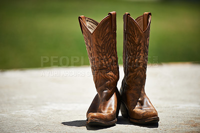 Buy stock photo Cowboy, boots and vintage in outdoor fashion, shoes and leather for horse riding. Countryside, style and design for footwear with pattern, stitching and western landscape or grassland and farm  