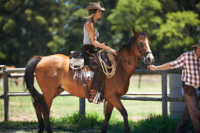 Buy stock photo Female woman, horse and farm with cowboy, stable and ranch in Texas for pony riding. Stallion, mare and animal  paddock for equestrian learning, countryside and lessons for sports for beginner rider