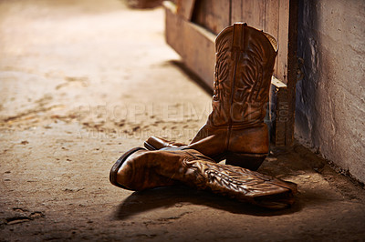 Buy stock photo Cowboy boots, ranch and style at farm for walking, safety and retro fashion on floor, ground and barn. Shoes, leather product and vintage heel with pattern for steps, western aesthetic or culture