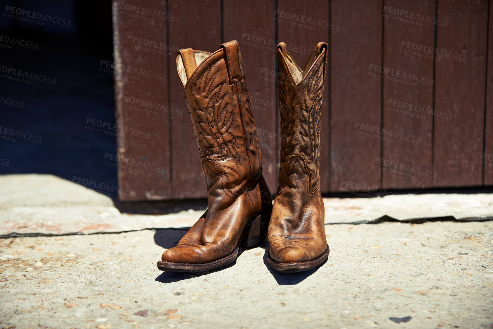 Buy stock photo Cowboy boots, ranch and style at farm for walking, safety and retro fashion on floor, ground and barn. Shoes, leather product and vintage heel for steps, outdoor or aesthetic for agriculture in Texas