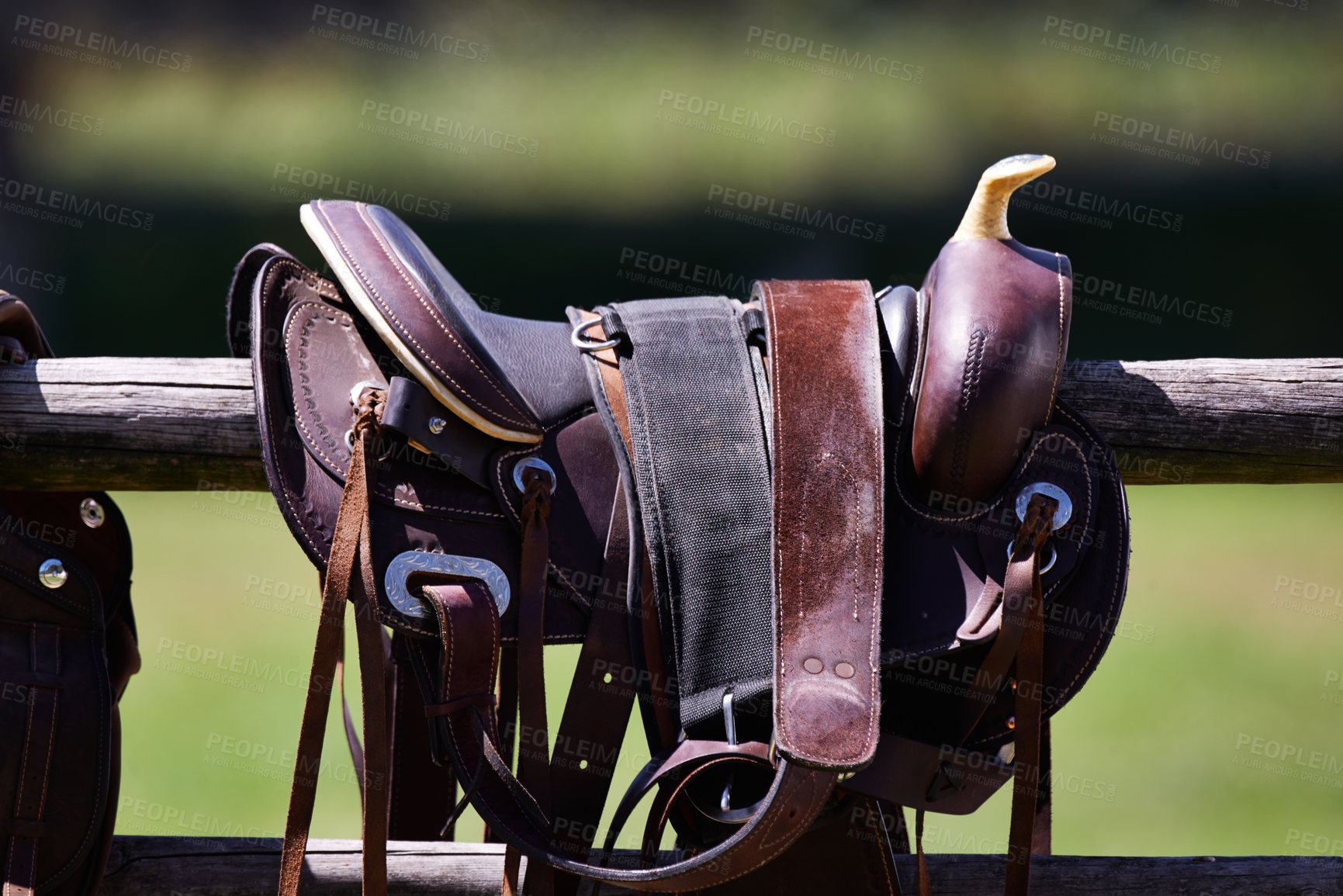 Buy stock photo Cropped shot of a saddle on a fence