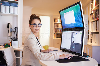 Buy stock photo Portrait of a young woman working on a dual-screen computer at home
