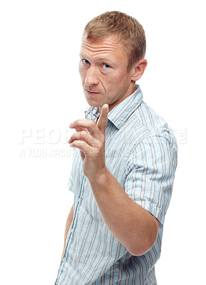 Buy stock photo Man, angry and point in studio portrait with attention, warning or frown for sign by white background. Person, frustrated and hand for icon, symbol or show danger with serious expression for attitude