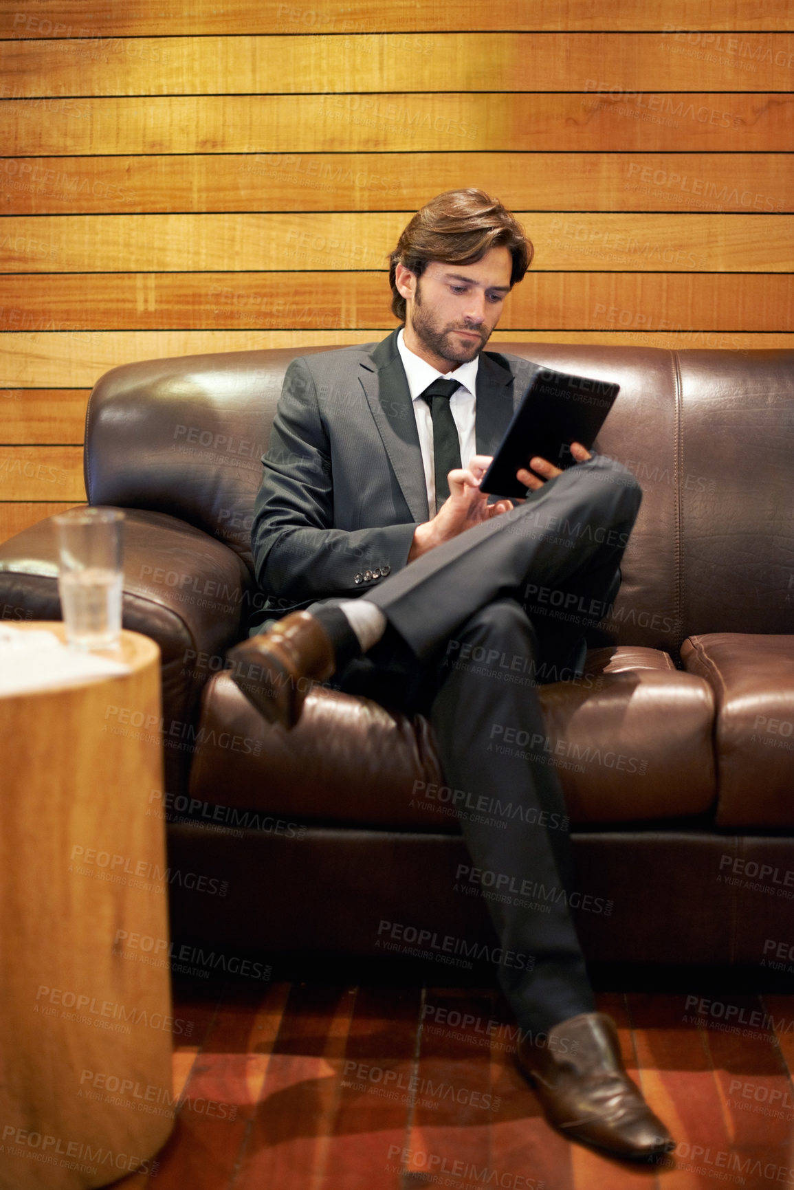 Buy stock photo Businessman, office and lobby for tablet, scroll and formal for job and workplace in corporate. Professional male person, browsing and research for company, startup and online in accounting firm