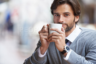 Buy stock photo A happy businessman drinking coffee outdoors at a coffee shop