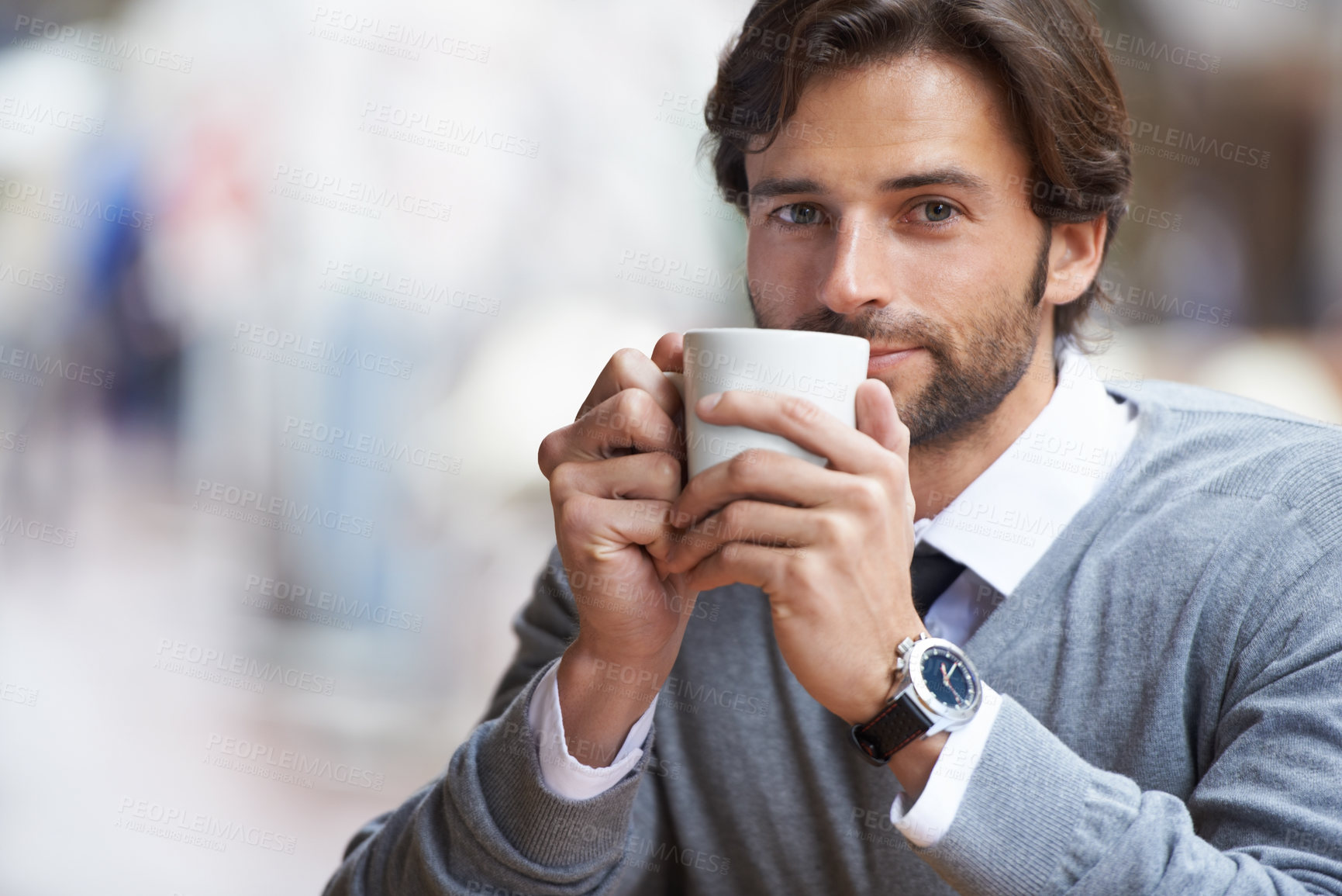 Buy stock photo A happy businessman drinking coffee outdoors at a coffee shop