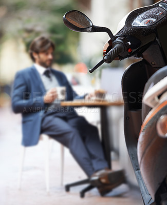 Buy stock photo Scooter, city and businessman at outdoor restaurant for remote work on laptop or transport in morning. Travel, vehicle and street coffee shop with corporate person in suit working at sidewalk cafe