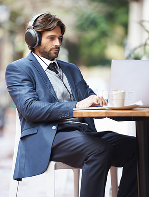 Buy stock photo Businessman, laptop and headphone working in cafe, internet and social media for online meeting and remote work. Professional, technology and lunch break with coffee and google it for networking idea