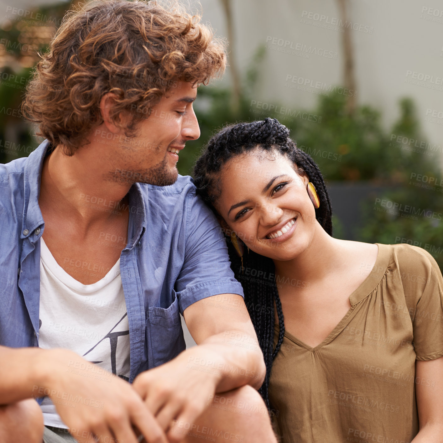 Buy stock photo Diverse couple, outside and smile for bonding, park and date together in summer for boyfriend and girlfriend. Multiracial, male and female for nature, happy and love for outdoor of city life