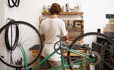Buy stock photo Mechanic, bicycle and garage with tools to service for maintenance, fixing and startup business. Back view, workshop and bike at work with instruments as expert with career to check and repair 