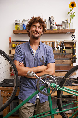 Buy stock photo Mechanic, bicycle and smile with tools at workshop for repair, maintenance with small business. Entrepreneur, handyman and garage as expert for diy to fix bike with equipment for service and upgrade