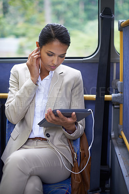 Buy stock photo Woman, streaming and travel on bus with tablet and earphones for journey and transport in outdoor. Business person and research with formal clothes and tech online for communication and commute