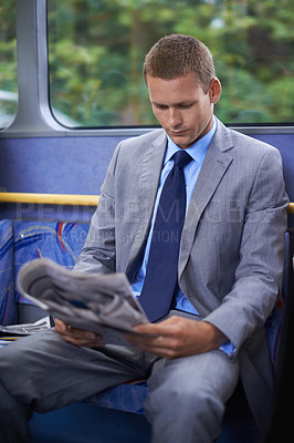 Buy stock photo Newspaper, public transport and business man on bus for morning commute to work for start of career or job. Employment, profession and work with young passenger reading on shuttle in city for transit