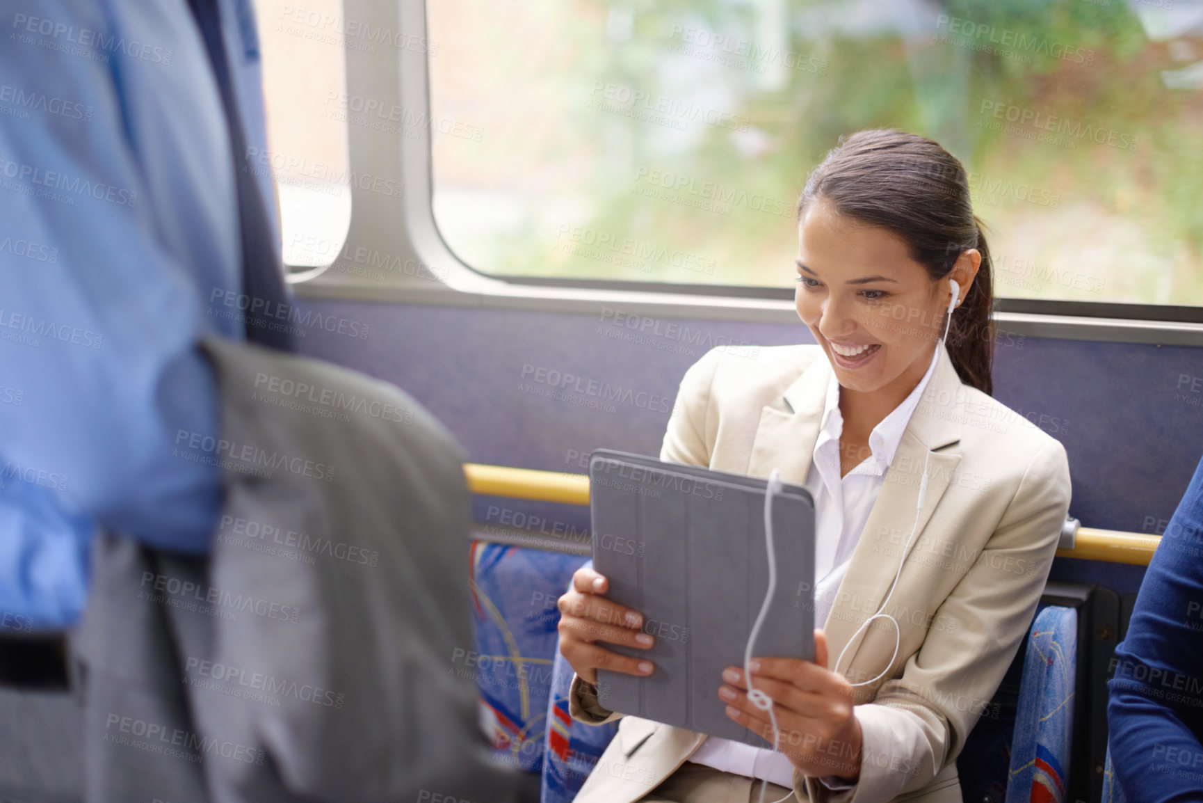 Buy stock photo Woman, bus and earphones for music on tablet, public transportation and reading on social media. Female person, internet and playlist on metro or transit, happy and commute with tech and travel