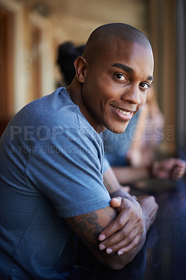 Buy stock photo Portrait, happy and a black man at pub to relax, cheerful or positive facial expression for leisure at restaurant in Kenya. Face, bar and smile of African person or customer in casual clothes at cafe