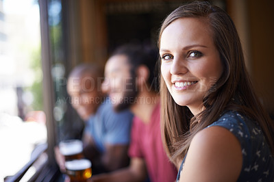 Buy stock photo Portrait, happy and a woman at pub to relax, cheerful or positive facial expression for leisure at restaurant tavern. Face, bar and smile of young female person or casual customer at cafe for alcohol