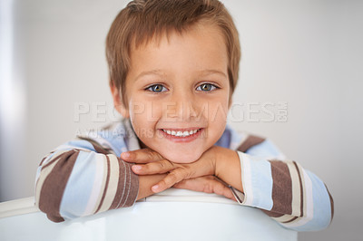 Buy stock photo Portrait, happiness and boy for relax in home on weekend, excited and rest on school holiday for leisure. Child, smile and cute face on vacation in house, calm and childhood wellness in apartment