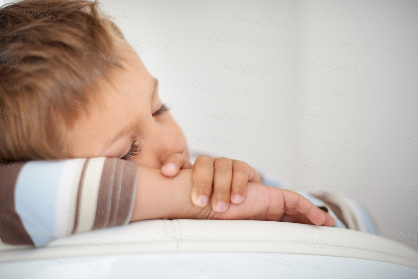 Buy stock photo A cropped shot of a cute little boy sleeping