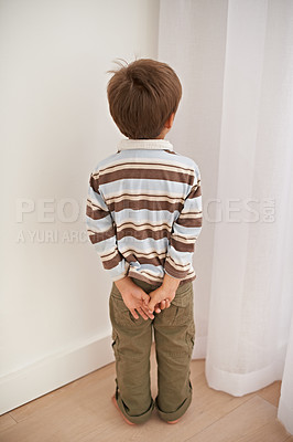 Buy stock photo Child boy, trouble and time out for bad behaviour, discipline and parenting in family home. Punishment, small kid or son  in corner of living room, house and childhood development for toddler