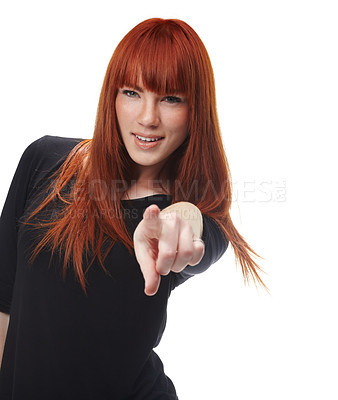 Buy stock photo Confident, pointing to you and portrait of woman on a white background in trendy clothes, style or outfit. Fashion, ginger hair and isolated person with hand gesture for choice or selection in studio