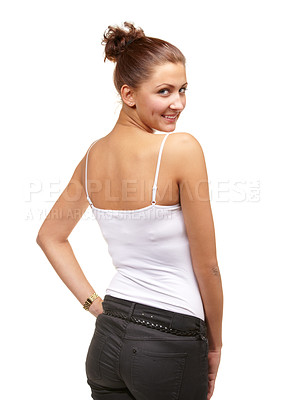 Buy stock photo Portrait, fashion and smile with woman looking back over shoulder in studio isolated on white background. Happy, confident or flirt and young casual person in tank top or vest to model clothes outfit