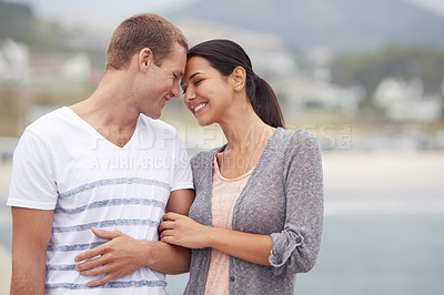 Buy stock photo Couple, hug and walk on the beach for travel, forehead touch and happiness together outdoor. Romantic adventure, love and affection for bonding, support and trust with commitment on holiday in Mexico